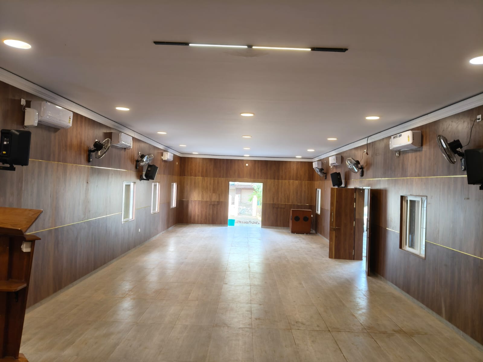 Wide rear-facing view of the timber-paneled CSI Church hall