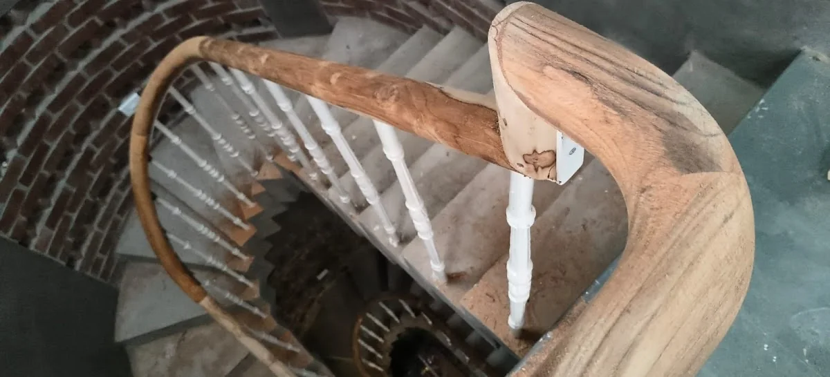 Finished curved timber staircase handrail